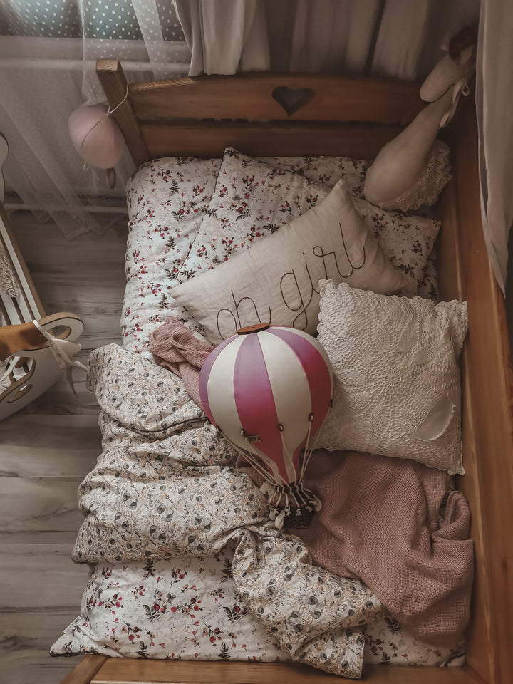Stylish hot air balloon in pastel pink and cream stripes, featuring a decorative basket – perfect for adding charm and imagination to a child’s room or nursery.